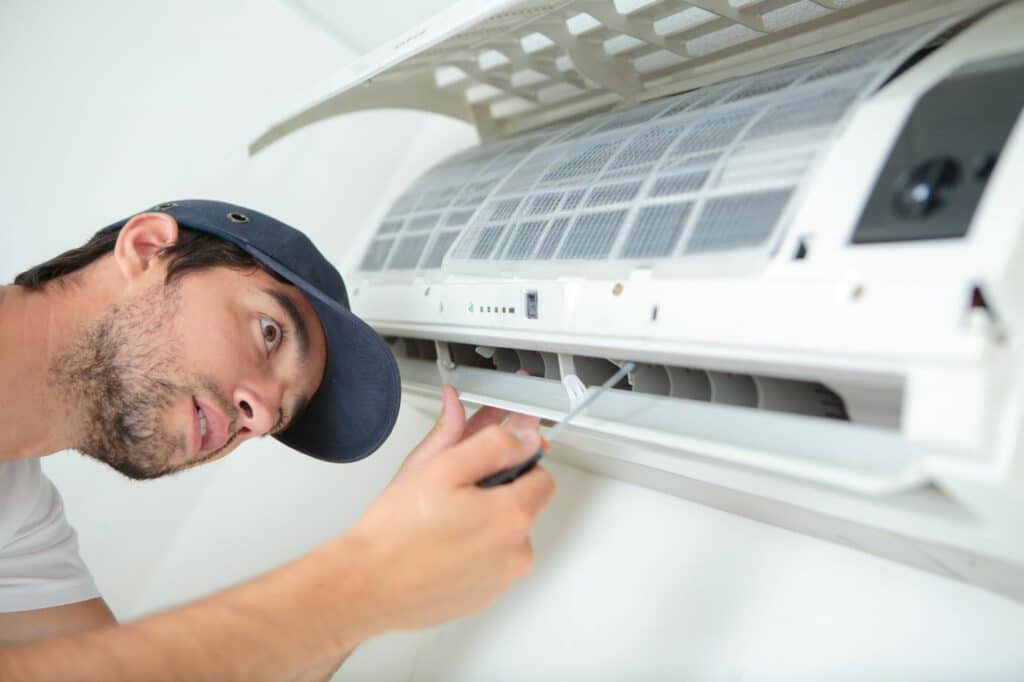 electrician working on air conditioning system