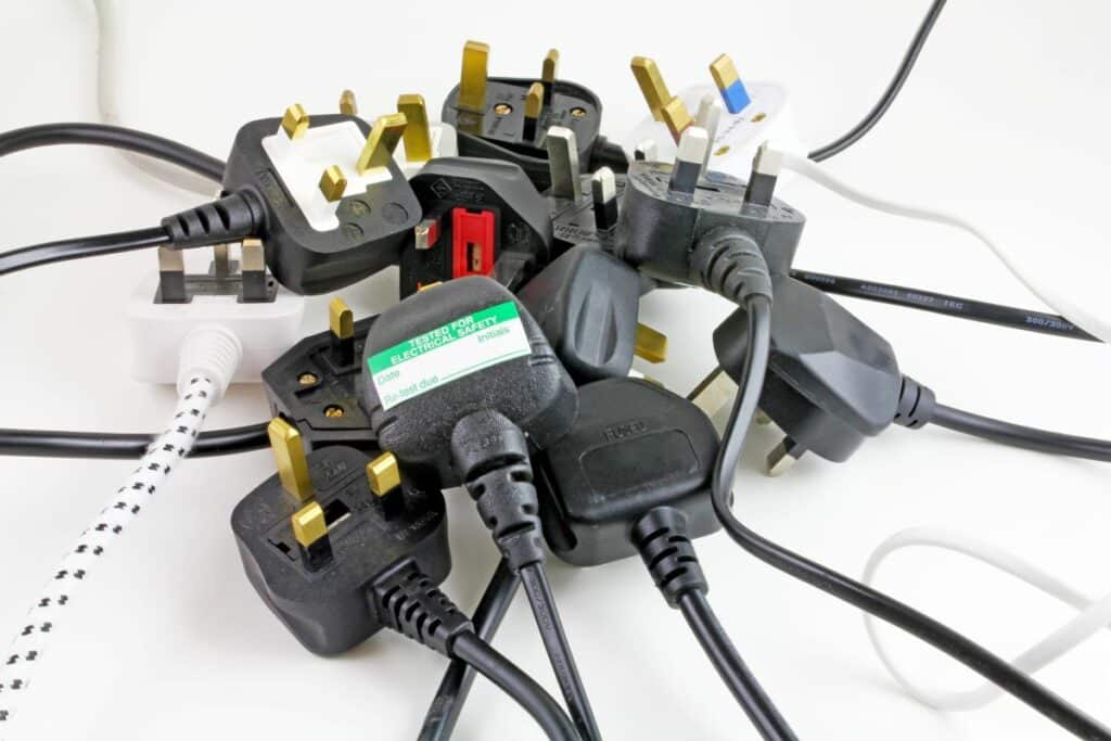 pile of electrical plugs for testing and tagging