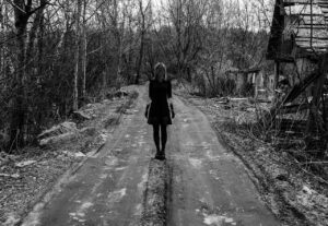 Lady walking down a haunted road in Ipswich